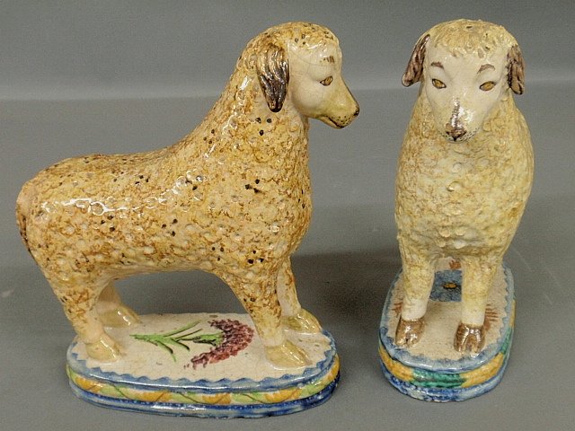 Pair of faience standing sheep, 19th c., with colorful: Pair of faience standing sheep, 19th c., with colorful oval bases. 9h.x8.5"l.x3.5"w."
