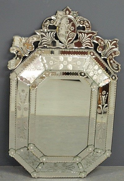Venetian style mirror with etched and multi-paneled: Venetian style mirror with etched and multi-paneled glass surround. 48.5"h.x30"w.