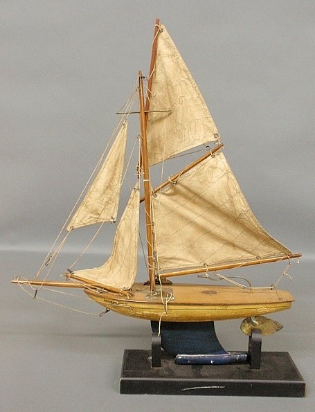 Gaff-rigged ÒStar Yacht pond model with original label: Gaff-rigged ÒStar Yacht pond model with original label and sails, mounted on a stand. Overall w/stand 24.5"h.x20"l."