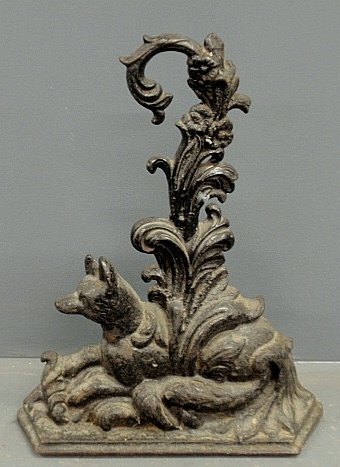 Victorian cast iron seated fox and branch doorstop.: Victorian cast iron seated fox and branch doorstop. 16.5"h.x13"w.x3.25"d.
