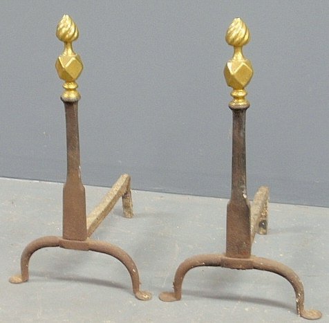 Pair of cast iron andirons, c.1780, with brass flame: Pair of cast iron andirons, c.1780, with brass flame and faceted tops. 21h.x12"w.x14.5"d."