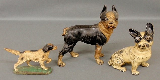 Three Victorian cast iron dog-form doorstops, largest: Three Victorian cast iron dog-form doorstops, largest 9.5h.x9"l."