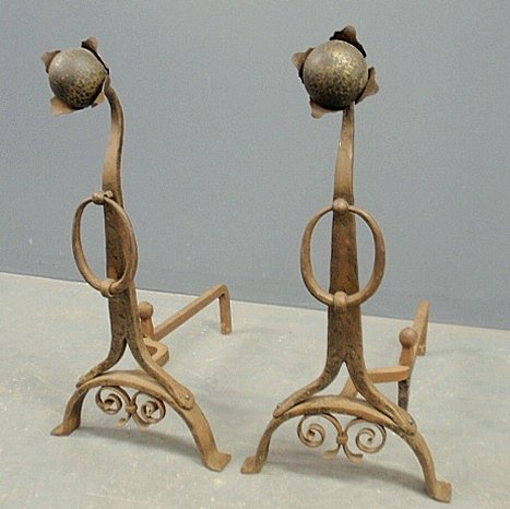 Pair of wrought iron sunflower andirons in the manner: Pair of wrought iron sunflower andirons in the manner of Samuel Yellin, Philadelphia. 26"h.x13"w.x22"d.