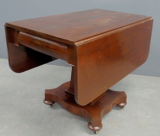 Classical mahogany drop-leaf table, c.1840, with two: Classical mahogany drop-leaf table, c.1840, with two drawers. 28.5"h., top 22"x36", each leaf 13"