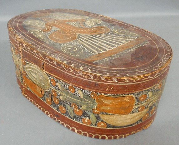German bride's box, 19th c., with original paint: German bride's box, 19th c., with original paint decoration, the lid with an angel and the sides with tulip decoration. 6"h.x17.5"w.x10.5"