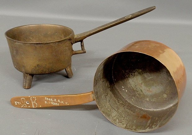 Heavy brass posnet pot, 8.25"h.x16.5"l., and a copper: Heavy brass posnet pot, 8.25"h.x16.5"l., and a copper pot signed "S. Brown".