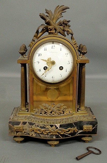 Fine French brass and marble mantel clock with ormolu: Fine French brass and marble mantel clock with ormolu mounts, the face signed "Tiffany & Co.", the works signed "E. Deux 1882". 13.5"h.x9"w.x5"d.