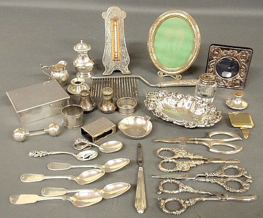 Group of sterling silver and silverplate tableware to: Group of sterling silver and silverplate tableware to include a cake breaker, sterling candy dish 7"l., picture frames, grape shears, etc.
