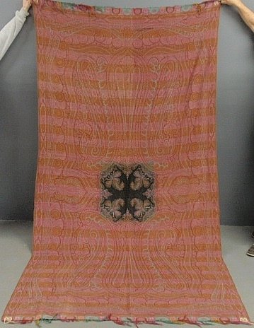 Red paisley cover with center medallion. 61”w.x122”l.: Red paisley cover with center medallion.61”w.x122”l.