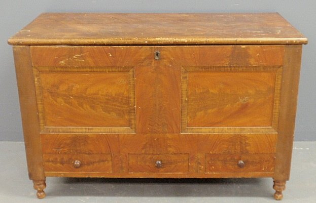 Pennsylvania Sheraton poplar flame grain painted: Pennsylvania Sheraton poplar flame grain painted blanket chest, c.1820, with a lift lid above three drawers and turned feet. 31.5"h.x49"w.x23.5"d.