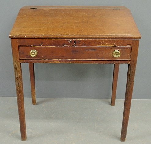 Pine slant-lid schoolmaster's desk, c.1860, with a: Pine slant-lid schoolmaster's desk, c.1860, with a single drawer. 39"h.x35.5"w.x24"d.