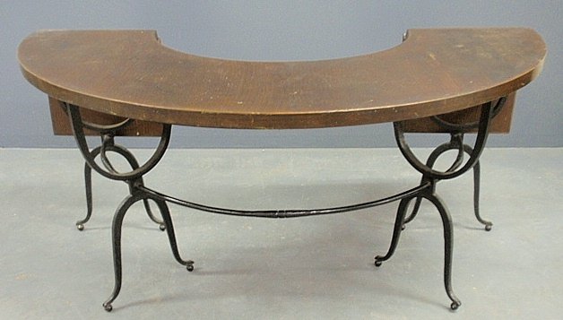 Wrought iron and oak conservatory table in the style of: Wrought iron and oak conservatory table in the style of Samuel Yellin, with two drop leaves that, when extended, supported by metal pull-out rods. 28.5"h.x63"w.x46"deep overall, table surface 16"deep