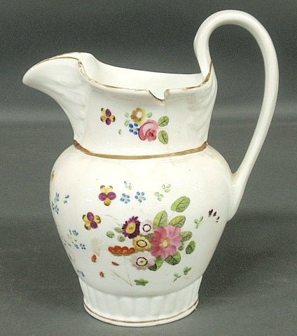 Tucker, Philadelphia porcelain pitcher, c.1830, with: Tucker, Philadelphia porcelain pitcher, c.1830, with floral decoration. As found. 9.5"h.