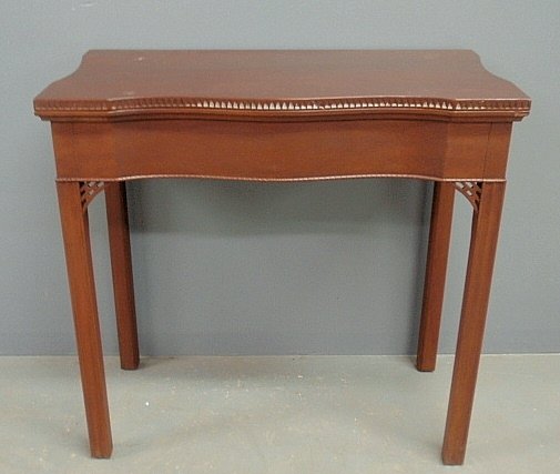 Chippendale style mahogany flip-top gaming table by: Chippendale style mahogany flip-top gaming table by Kittinger. 29"h.x30.5"w.x16"d.