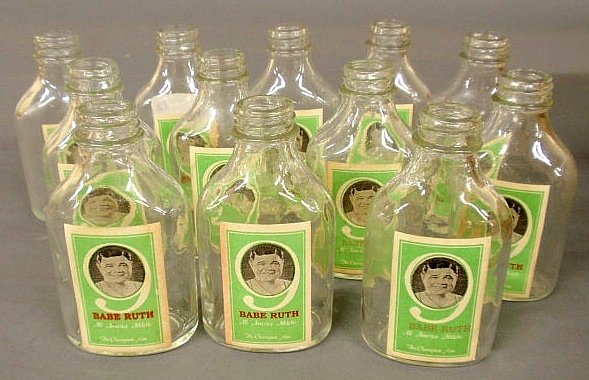 Twelve glass bottles with paper labels "Babe Ruth- All: Twelve glass bottles with paper labels "Babe Ruth- All American Athletic- The Champion Nine". 4.5"h. each