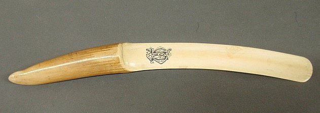 Inuit walrus tusk page turner, 19th c., with incised: Inuit walrus tusk page turner, 19th c., with incised inked monogram. 17.5"l.x2"w.