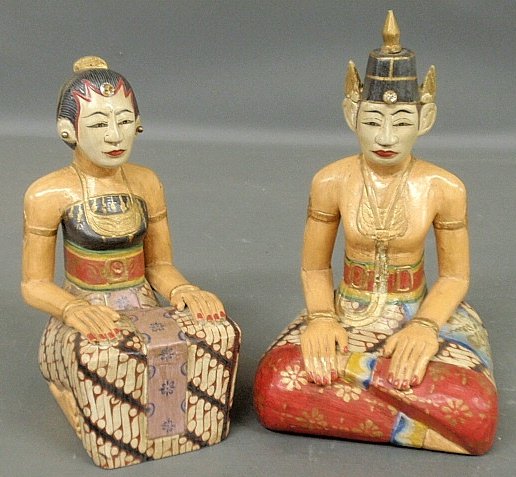 Indonesian carved and polychrome decorated figures of a: Indonesian carved and polychrome decorated figures of a seated wedding couple, groom- 11"h.x6.5"w.x5"d.