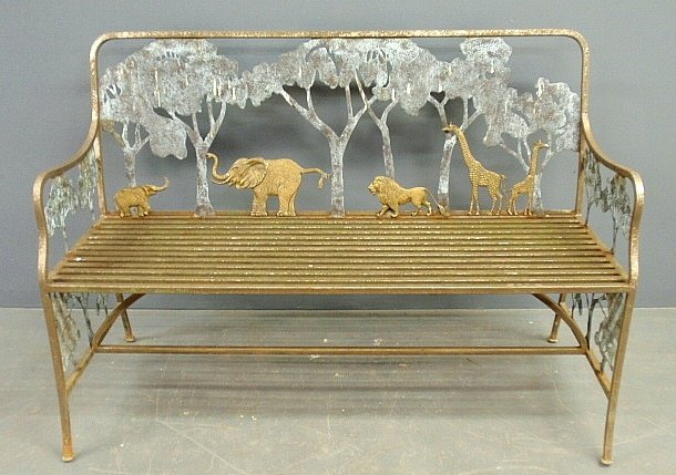 Wrought iron and brass garden settee decorated with: Wrought iron and brass garden settee decorated with African animals. 37"h.x54"w.x27"d., seat 18"h.