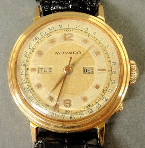 Man's gold Movado wristwatch, the back engraved "Wm.: Man's gold Movado wristwatch, the back engraved "Wm. Edward Frazer, Jr. 5-13-51", 1.25"dia., tested as most likely 14k.