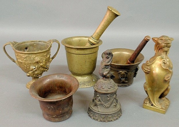 Group of mostly 19th c. metalware- bronze bell with boy: Group of mostly 19th c. metalware- bronze bell with boy riding a dolphin 7"h., chalice, mortars & pestles, standing lion with shield 7.5"h.