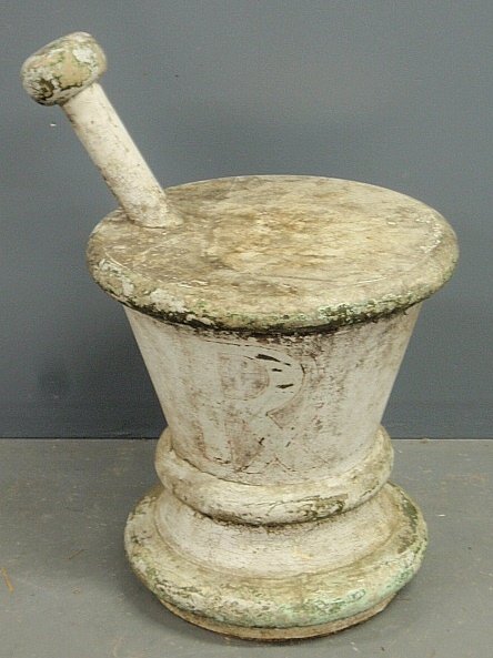 Large 19th c. carved wood mortar & pestle with an iron: Large 19th c. carved wood mortar & pestle with an iron base and old white paint decoration, made for display in an apothecary window. 28"h.x18"dia.