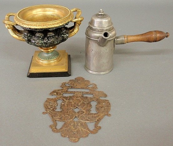 Group of metalware- rare pewter chocolate pot dated: Group of metalware- rare pewter chocolate pot dated 1825, 5.5"h., gilt metal urn 6.5"w., and an ornate Continental metal escutcheon 7"h.