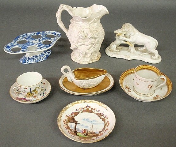 Seven pieces of porcelain tableware to incl. a Parian p: Seven pieces of porcelain tableware to incl. a Parian pitcher 7”h., Sevres creamer, Meissen cup & saucer, Worcester cup & saucer, Royal Vienna lion and dog figural group 7.5”l. (as found), etc.
