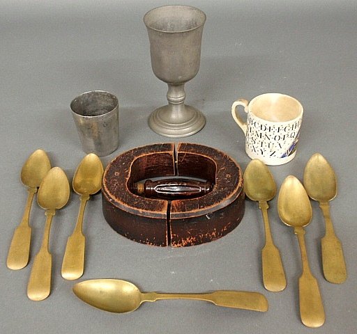 Pewter chalice 7”h. and a pewter beaker, hat mold 7.25”: Pewter chalice 7”h. and a pewter beaker, hat mold 7.25”w., ABC’s cup and 7 brass spoons 8”l.