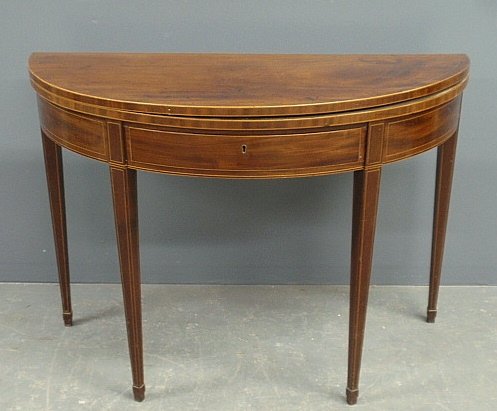English Hepplewhite inlaid mahogany demilune flip-top: English Hepplewhite inlaid mahogany demilune flip-top card table, c.1790, with a single drawer. 29"h.x40"w.x18"d.