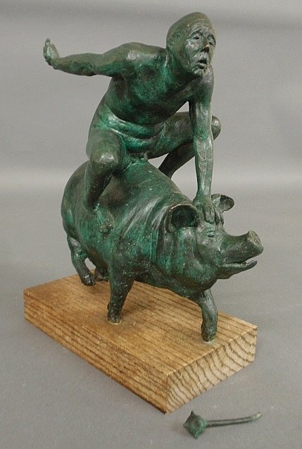 Bronze sculpture, late 20th c., of a naked man wielding: Bronze sculpture, late 20th c., of a naked man wielding a mace and riding a sow pig, and mounted ion an oak base. As found. Base-14"h.x8.5"w.5"d.
