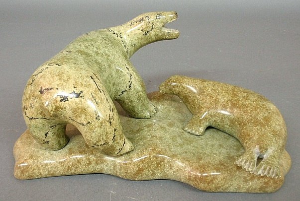Carved stone Temela Natenik Inuit sculpture of a bear: Carved stone Temela Natenik Inuit sculpture of a bear and seal on an iceberg, signed "Newgilliak E 7_99". 6"h.x13"w.x7"d.
