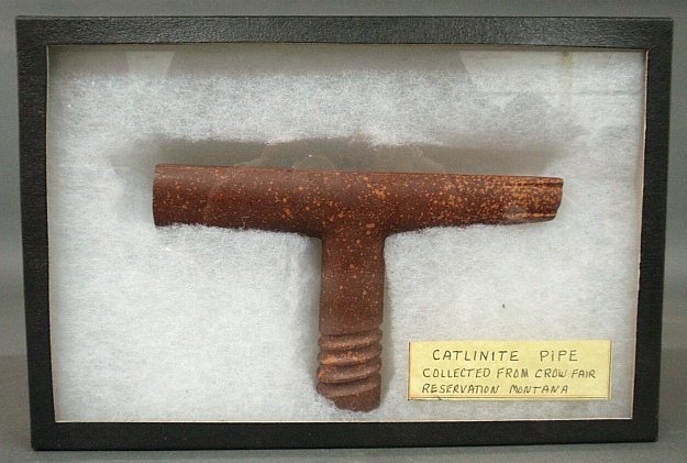 Carved catlinite pipe from Crow Indian reservation in: Carved catlinite pipe from Crow Indian reservation in Montana. 5"h.x8"l.
