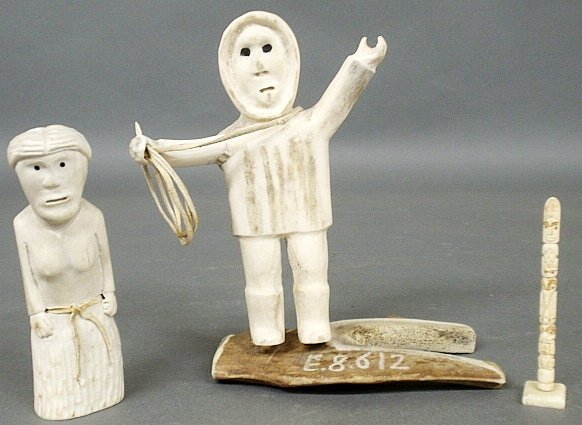 Group of Inuit carvings to incl. a whaler holding a: Group of Inuit carvings to incl. a whaler holding a fishing line 8"h., totem pole 4"h. and female figure 6"h.