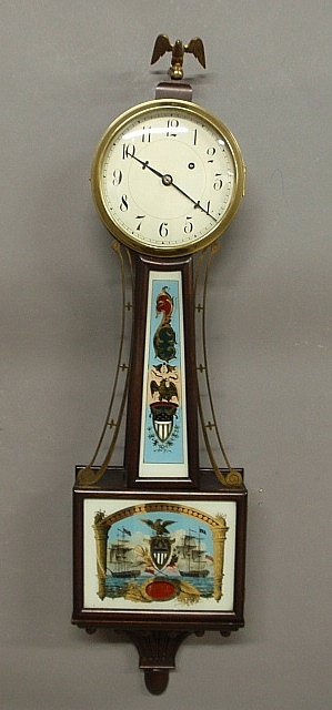 Mahogany cased presentation banjo clock with reverse: Mahogany cased presentation banjo clock with reverse painted glass panel of the USS Constitution under the command of Isaac Hull. 40"h.x10.5"w.