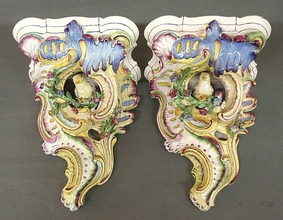 Pair of colorful French Majolica wall brackets with: Pair of colorful French Majolica wall brackets with floral and bird decoration. 12"h.x9"w.x7"d.