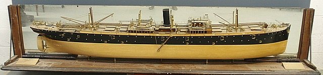 Massive finely detailed wood and brass builder's: Massive finely detailed wood and brass builder's half-hull model of the steel screw steamer Eagle Point, mounted in a partial late 19th c. walnut display case. The ship built by Joseph L. Thompson & S