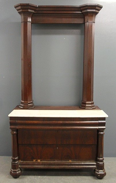 Empire mahogany dressing table, c.1840, with marble: Empire mahogany dressing table, c.1840, with marble top, bold cornice and flanking storage columns. As found. 89"h.x48"w.x22.5"d.