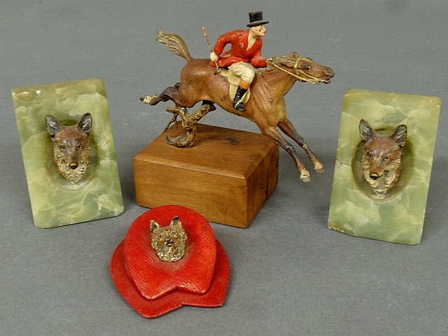 Pair of Vienna bronze fox mask and green onyx bookends: Pair of Vienna bronze fox mask and green onyx bookends 4"h.x2.5"w., a Vienna bronze fox hunter and jumping horse mounted on a wood base 6.5"h., and a Vienna bronze and leather paperclip.