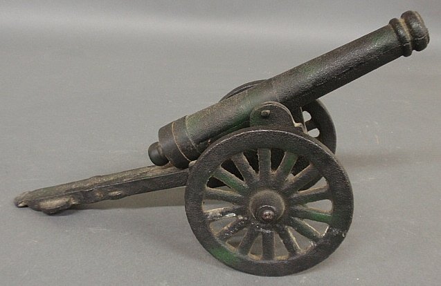 Cast iron cannon, early 20th c. 7"h.x15"l.x6"w., barrel: Cast iron cannon, early 20th c. 7"h.x15"l.x6"w., barrel 10"l.
