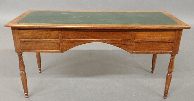 Miniature Sheraton style mahogany executive desk with: Miniature Sheraton style mahogany executive desk with leather top. 8"h.x16"w.x7"d.