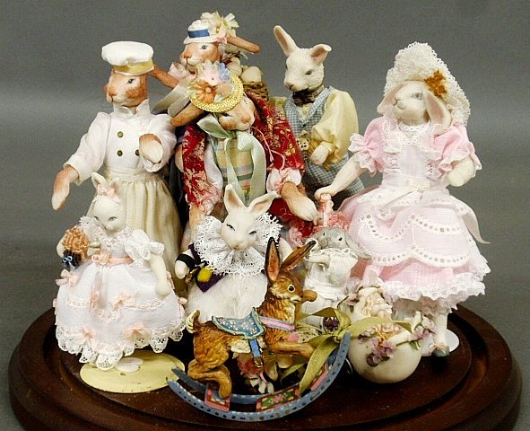 Glass dome cased miniature setting- Bunny Family, 1": Glass dome cased miniature setting- Bunny Family, 1" scale, with Victorian dress plus bunny rocker. 12"h.x9"dia.