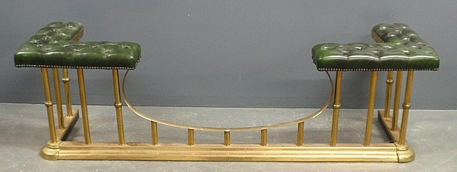 English brass club fender, 20th c., with green tufted: English brass club fender, 20th c., with green tufted leather seat. 20"h.x69"l.x20"d.