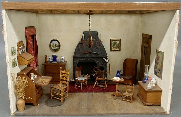 Rare Narcissa N. Thorne miniature room box of a Colonia: Rare Narcissa N. Thorne miniature room box of a Colonial keeping room with stone fireplace, spinning wheel & hanging copper chandelier, and label verso “American Room by Narcissa Thorne”. Box 12��