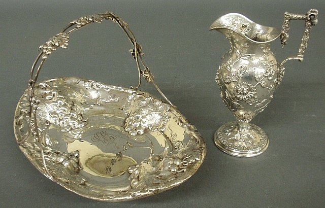S. Kirk & Son sterling silver cream pitcher marked 925,: S. Kirk & Son sterling silver cream pitcher marked 925, 7.25"h., and a sterling silver basket 11"l. 15 troy oz.