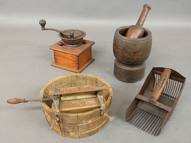 Group of woodware to incl. salesman's sample clothes: Group of woodware to incl. salesman's sample clothes wringer "Relief Wringer" 7.25"h., mortar & pestle, coffee grinder by C.P. Company and a cranberry scoop by N. Latterberg 8.25"l.
