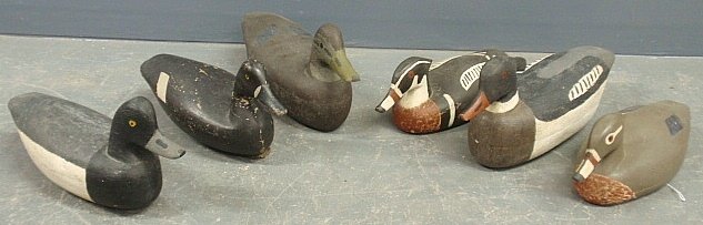 Six duck decoys, some by Reuben C. Corlies, (1882-1976): Six duck decoys, some by Reuben C. Corlies, (1882-1976) Manahawkin, NJ, largest 7”h.x16”l.x5”w.