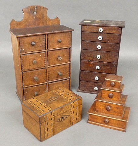 Two small spice or tea storage chests- one hanging exam: Two small spice or tea storage chests- one hanging example 17”h.x10.5”w., with porcelain knobs, a stacking Tramp Art example and an inlaid tea caddy.