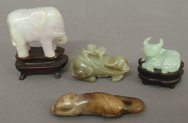 Four small carved jade figures- elephant on stand: Four small carved jade figures- elephant on stand 2.5"h., seated water buffalo 1.5", boy and water buffalo netsuke and a carved squirrel netsuke.