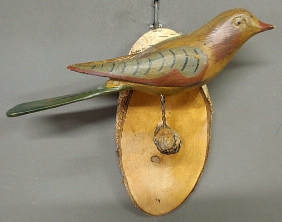 Continental carved wood and polychrome decorated bird: Continental carved wood and polychrome decorated bird mounted on a birch plaque, early 20th c. 10"h.x10.25"w.x4.5"d.