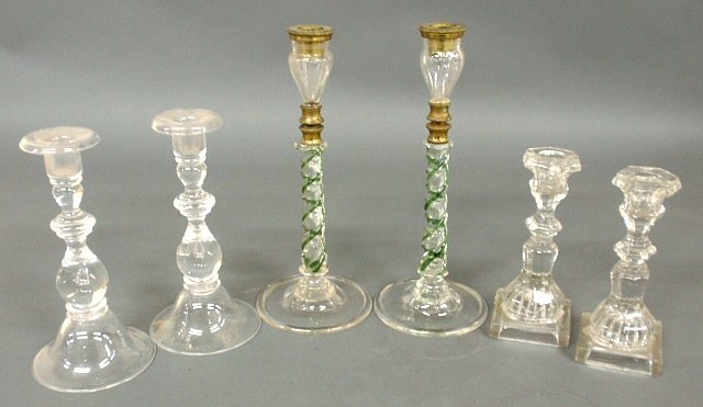 Pair of clear flint candlesticks, pair of late 19th c.: Pair of clear flint candlesticks, pair of late 19th c. green & clear swirl glass candlesticks with gilt mounts 12"h. (lacking bobesches) and another pair of glass candlesticks